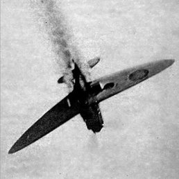 Spitfire shot down. Spitfire shot down, trailing smoke as it falls.