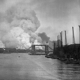 London burning. London burning: smoke rising behind Tower Bridge during the Blitz.