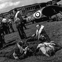 32 Sqn pilots at readiness on the grass beside their Spitfires at RAF Hawkinge. 32 Sqn pilots at readiness on the grass beside their Spitfires at RAF Hawkinge.