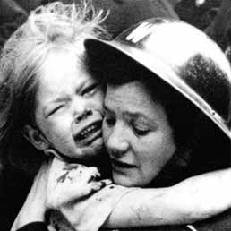 Air Raid Warden rescues a child after a V1 rocket attack. Air Raid Warden rescues a child after a V1 rocket attack.
